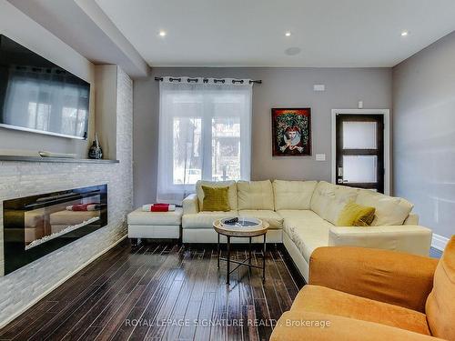 235 Bain Ave, Toronto, ON - Indoor Photo Showing Living Room With Fireplace