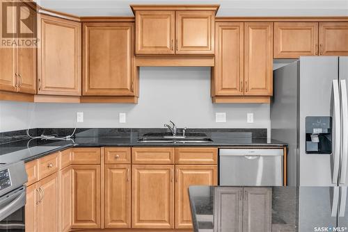 311 619 Saskatchewan Crescent W, Saskatoon, SK - Indoor Photo Showing Kitchen With Stainless Steel Kitchen With Double Sink