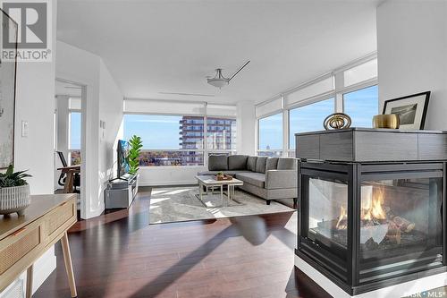 706 2300 Broad Street, Regina, SK - Indoor Photo Showing Living Room With Fireplace