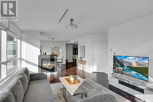 706 2300 Broad Street, Regina, SK - Indoor Photo Showing Living Room With Fireplace