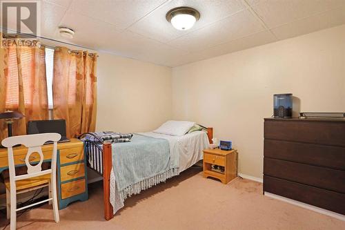 Bedroom 2 in Basement View 1 - 319 16 Street E, Brooks, AB - Indoor Photo Showing Bedroom