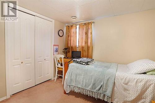 Bedroom 2 in Basement View 2 - 319 16 Street E, Brooks, AB - Indoor Photo Showing Bedroom