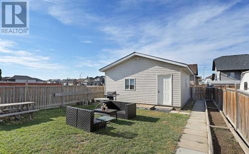 View from house to garage - 319 16 Street E, Brooks, AB - Outdoor With Exterior