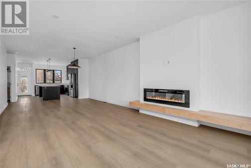 1315 Edward Avenue, Saskatoon, SK - Indoor Photo Showing Living Room With Fireplace