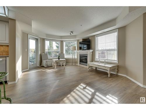 #312 9008 99 Av Nw, Edmonton, AB - Indoor Photo Showing Living Room With Fireplace