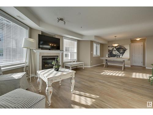 #312 9008 99 Av Nw, Edmonton, AB - Indoor Photo Showing Living Room With Fireplace