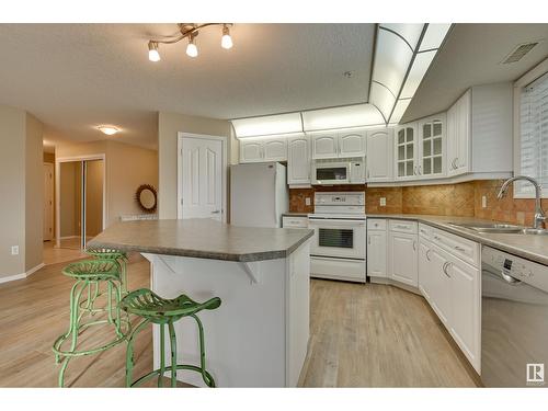 #312 9008 99 Av Nw, Edmonton, AB - Indoor Photo Showing Kitchen With Double Sink