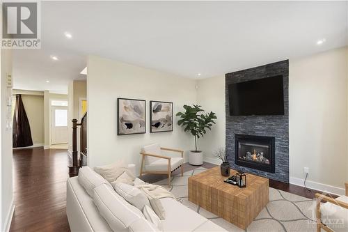 virtually staged - 637 Capuchon Way, Ottawa, ON - Indoor Photo Showing Living Room With Fireplace