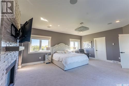 Saskatchewan Prestige Manor, Douglas Rm No. 436, SK - Indoor Photo Showing Bedroom With Fireplace