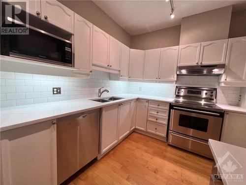 Classic white kitchen with new quartz countertops - 407 Mackay Street Unit#B, Ottawa, ON - Indoor Photo Showing Kitchen With Double Sink