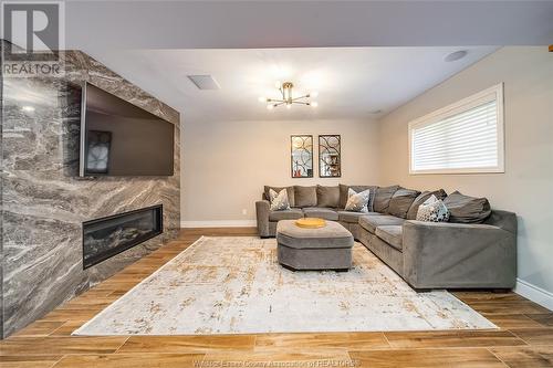 2083 Shawnee Road, Tecumseh, ON - Indoor Photo Showing Living Room With Fireplace