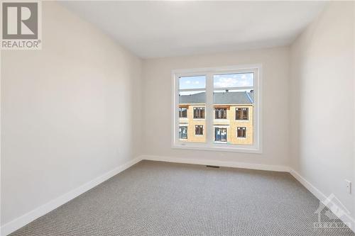 Upstairs offers a sunlit primary bedroom w/large walk-in closet - 402 Jewelwing Private, Ottawa, ON - Indoor Photo Showing Other Room