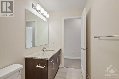 Embrace eco-conscious living with low flush water-saver toilets and Energy star certified high efficiency natural gas furnace - 402 Jewelwing Private, Ottawa, ON - Indoor Photo Showing Bathroom