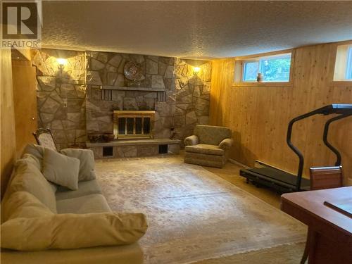 You enter a bright, spacious rec room with fireplace. - 1628 Grant Avenue, Cornwall, ON - Indoor With Fireplace