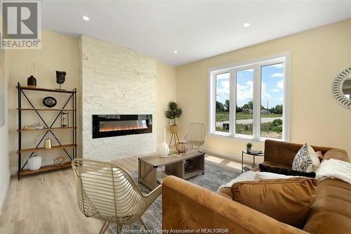 25 Hawthorne Crescent, Tilbury, ON - Indoor Photo Showing Living Room With Fireplace