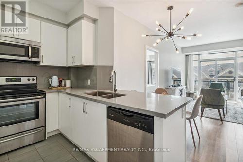 302 - 216 Oak Park Boulevard, Oakville, ON - Indoor Photo Showing Kitchen With Stainless Steel Kitchen With Double Sink With Upgraded Kitchen