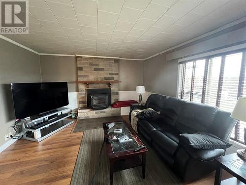 5007 47 Avenue, Pouce Coupe, BC - Indoor Photo Showing Living Room With Fireplace