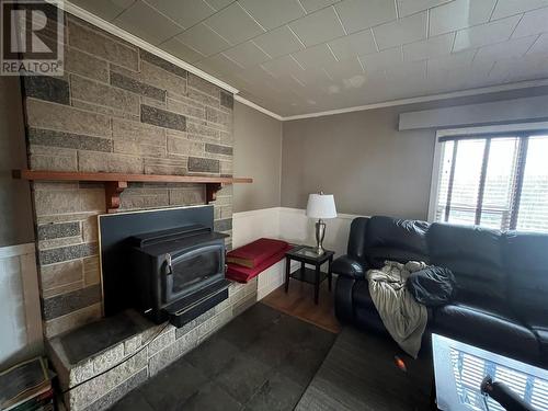 5007 47 Avenue, Pouce Coupe, BC - Indoor Photo Showing Living Room With Fireplace