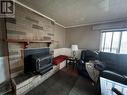 5007 47 Avenue, Pouce Coupe, BC  - Indoor Photo Showing Living Room With Fireplace 