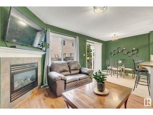 #120 5001 62 Street Nw, Beaumont, AB - Indoor Photo Showing Living Room With Fireplace