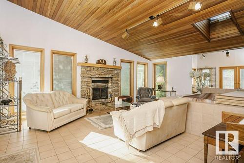 7715 144 Av Nw Nw, Edmonton, AB - Indoor Photo Showing Living Room With Fireplace