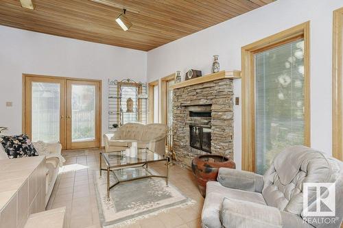 7715 144 Av Nw Nw, Edmonton, AB - Indoor Photo Showing Living Room With Fireplace