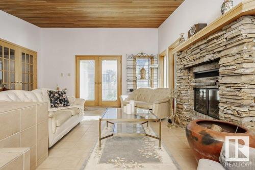 7715 144 Av Nw Nw, Edmonton, AB - Indoor Photo Showing Living Room With Fireplace