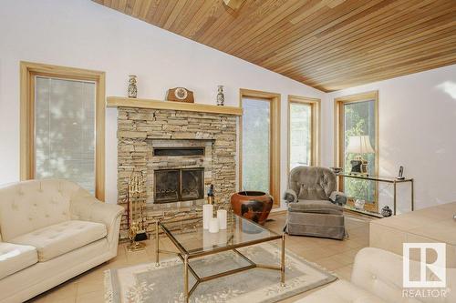 7715 144 Av Nw Nw, Edmonton, AB - Indoor Photo Showing Living Room With Fireplace