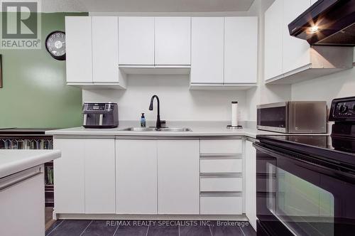 109 - 1275 Cornerbrook Place, Mississauga, ON - Indoor Photo Showing Kitchen With Double Sink