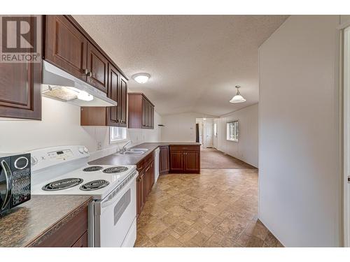 9773 Stephenson  Road Unit# 19, Fernie, BC - Indoor Photo Showing Kitchen With Double Sink