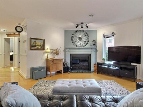 Living room - 104-787 Ch. Ozias-Leduc, Otterburn Park, QC - Indoor Photo Showing Living Room With Fireplace