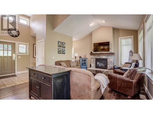 251 Predator Ridge Drive Unit# 36, Vernon, BC - Indoor Photo Showing Living Room With Fireplace