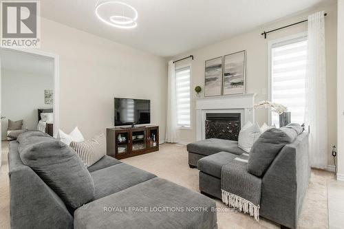 47 Allegra Drive, Wasaga Beach, ON - Indoor Photo Showing Living Room With Fireplace