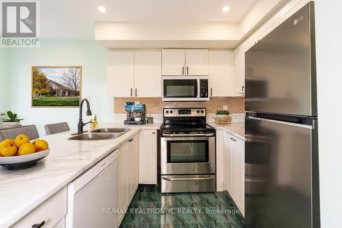 B202 - 98 Cornell Park Avenue, Markham, ON - Indoor Photo Showing Kitchen With Double Sink