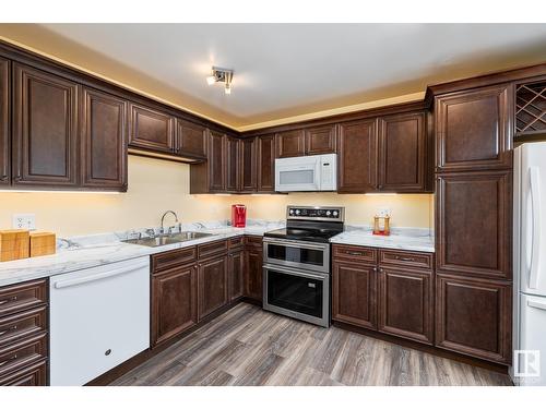 160 Roseland Vg Nw, Edmonton, AB - Indoor Photo Showing Kitchen With Double Sink