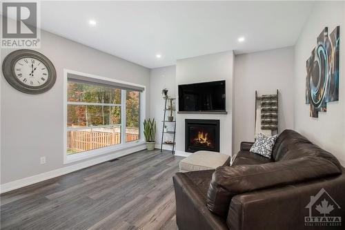 232 Nature Street, Casselman, ON - Indoor Photo Showing Living Room With Fireplace