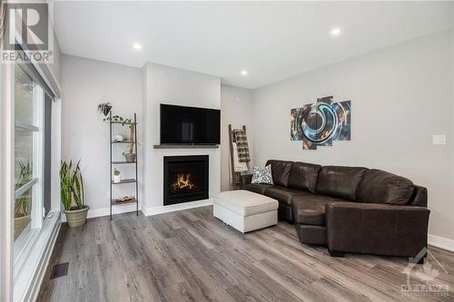 232 Nature Street, Casselman, ON - Indoor Photo Showing Living Room With Fireplace