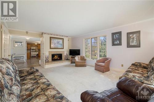 Large living room - 4000 Stonecrest Road, Ottawa, ON - Indoor Photo Showing Living Room With Fireplace