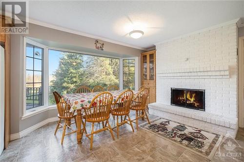 Kitchen with window with a view! - 4000 Stonecrest Road, Ottawa, ON - Indoor Photo Showing Dining Room With Fireplace