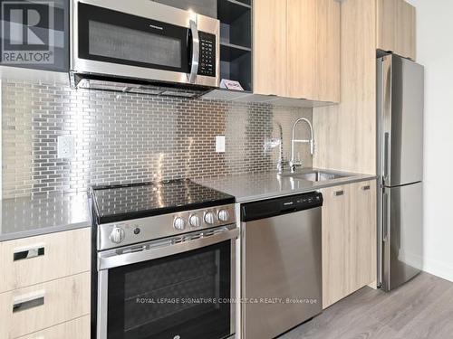 707 - 10 De Boers Drive, Toronto, ON - Indoor Photo Showing Kitchen With Stainless Steel Kitchen With Upgraded Kitchen