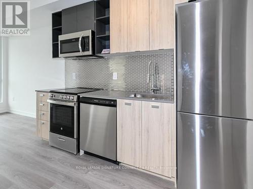 707 - 10 De Boers Drive, Toronto, ON - Indoor Photo Showing Kitchen With Stainless Steel Kitchen With Upgraded Kitchen