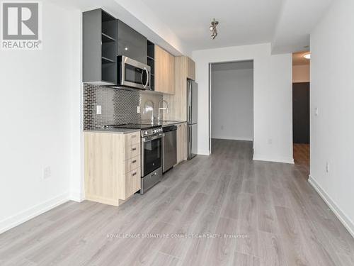 707 - 10 De Boers Drive, Toronto, ON - Indoor Photo Showing Kitchen With Stainless Steel Kitchen