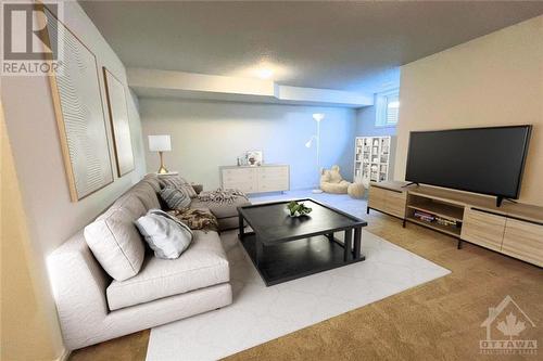 Virtually staged lower level - 550 Hitzlay Terrace, Ottawa, ON - Indoor Photo Showing Living Room