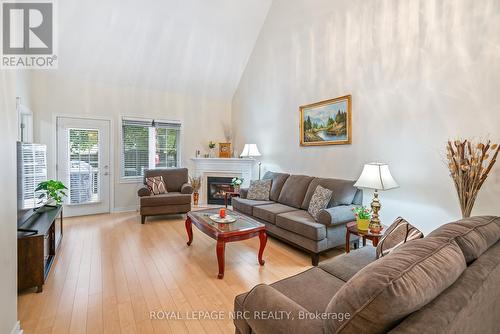 13 - 8142 Costabile Drive, Niagara Falls, ON - Indoor Photo Showing Living Room With Fireplace