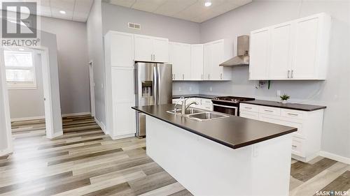 303 5Th Avenue W, Kindersley, SK - Indoor Photo Showing Kitchen With Stainless Steel Kitchen With Double Sink