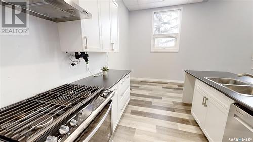 303 5Th Avenue W, Kindersley, SK - Indoor Photo Showing Kitchen With Double Sink