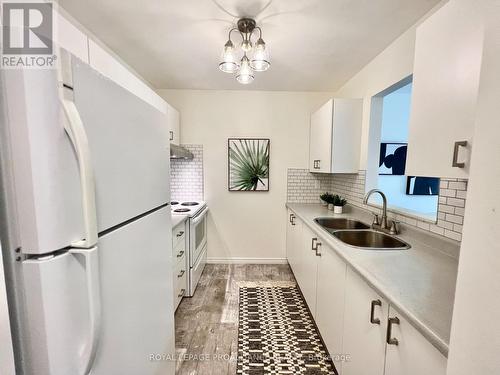 215 - 175 Haig Road, Belleville, ON - Indoor Photo Showing Kitchen With Double Sink