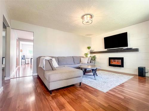 349 26Th Street, Brandon, MB - Indoor Photo Showing Living Room With Fireplace