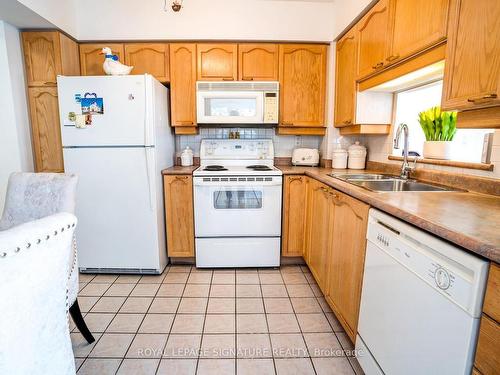 306-115 Bonis Ave, Toronto, ON - Indoor Photo Showing Kitchen With Double Sink