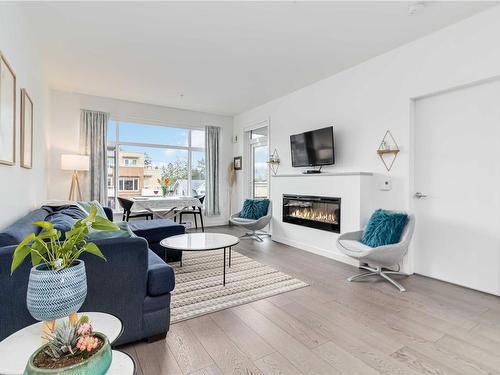 403-7162 West Saanich Rd, Central Saanich, BC - Indoor Photo Showing Living Room With Fireplace